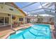 Enclosed pool area with a screen enclosure, outdoor seating, and a refreshing swimming pool at 6415 39Th W Ave, Bradenton, FL 34209