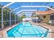Gorgeous screened pool and patio with lush landscaping providing a private oasis at 6415 39Th W Ave, Bradenton, FL 34209