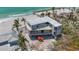 Modern home with a flat roof overlooking the ocean, showcasing its contemporary architectural design at 6603 Gulfside Rd, Longboat Key, FL 34228