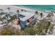 Aerial shot of a contemporary home featuring a flat roof, and situated in a beachfront community at 6603 Gulfside Rd, Longboat Key, FL 34228