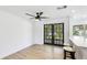 Bright room with updated floors, leading to a modern kitchen and a view of the outdoors at 6628 Keystone Dr, Sarasota, FL 34231