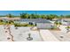 Beautiful one-story home with a white exterior, a well manicured yard and a concrete driveway at 6628 Keystone Dr, Sarasota, FL 34231