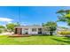 Charming single-story home with a well-manicured lawn and inviting front deck at 6628 Keystone Dr, Sarasota, FL 34231