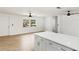 Bright, open living space featuring updated floors and kitchen with a quartz island at 6628 Keystone Dr, Sarasota, FL 34231
