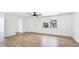 Spacious living room with modern flooring, fresh paint, abundant natural light, and new ceiling fan at 6628 Keystone Dr, Sarasota, FL 34231