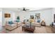 Bright living room with plush sofas, a ceiling fan, and ample natural light for a cozy atmosphere at 6628 Keystone Dr, Sarasota, FL 34231