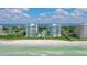 Stunning aerial view of beachfront condos with pristine white sand and clear blue ocean waters at 675 Longboat Club Rd # 23A, Longboat Key, FL 34228