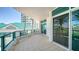 Spacious balcony featuring tile flooring and glass railings, perfect for enjoying outdoor living at 675 Longboat Club Rd # 23A, Longboat Key, FL 34228