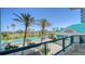 Beautiful balcony view overlooking lush golf course, and resort-style amenities with tropical landscaping at 675 Longboat Club Rd # 23A, Longboat Key, FL 34228
