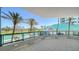 Expansive balcony with palm trees and golf course views offers ample outdoor living space at 675 Longboat Club Rd # 23A, Longboat Key, FL 34228