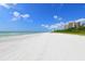 Beautiful white sand beach with clear blue water at 675 Longboat Club Rd # 23A, Longboat Key, FL 34228