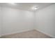 Bright bedroom featuring neutral carpet, light walls, and overhead lighting at 675 Longboat Club Rd # 23A, Longboat Key, FL 34228