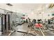 Well-equipped gym with modern exercise equipment, including treadmills, weights, and mirrored walls at 675 Longboat Club Rd # 23A, Longboat Key, FL 34228