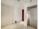 Well-lit hallway featuring tiled floors and a mirrored elevator at 675 Longboat Club Rd # 23A, Longboat Key, FL 34228