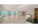 Bright, spacious living room with ocean views and tile flooring in a luxurious condo at 675 Longboat Club Rd # 23A, Longboat Key, FL 34228
