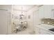 Cozy dining area features a chandelier, decorative wall art, and complements the adjacent kitchen space at 6770 Fairway Gardens Dr, Bradenton, FL 34203