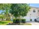 Charming home exterior featuring a well-manicured lawn and a two-car garage at 6770 Fairway Gardens Dr, Bradenton, FL 34203