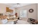 Cozy living room features comfortable seating, bright window, and stylish decor at 6770 Fairway Gardens Dr, Bradenton, FL 34203