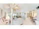 Bright and airy living room featuring high ceilings and tile floors at 6770 Fairway Gardens Dr, Bradenton, FL 34203