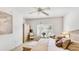 Bright main bedroom boasts plantation shutters, ample natural light, and a calming color scheme at 6770 Fairway Gardens Dr, Bradenton, FL 34203