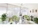 Bright sunroom with lots of light and decor; a great place to relax and unwind at 6770 Fairway Gardens Dr, Bradenton, FL 34203