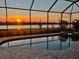Stunning pool at sunset offering beautiful water views and relaxed outdoor living at 7036 Highgate Ln, Lakewood Ranch, FL 34202