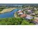 Stunning aerial view of waterfront homes nestled along a picturesque lake and community at 7538 Camden Harbour Dr, Bradenton, FL 34212