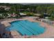 Large community pool with splash pad, lounge chairs, and shaded seating areas at 7538 Camden Harbour Dr, Bradenton, FL 34212