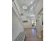 Spacious foyer showcasing a staircase, stylish lighting fixtures, and a view into the living spaces at 7538 Camden Harbour Dr, Bradenton, FL 34212