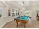Game room features a pool table, recessed lighting and light wood floors at 7538 Camden Harbour Dr, Bradenton, FL 34212