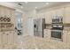 Spacious kitchen with stainless appliances, granite countertops, and ample cabinet storage at 7538 Camden Harbour Dr, Bradenton, FL 34212