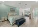 Bedroom with king bed, ceiling fan, wood floors, and sitting area at 7538 Camden Harbour Dr, Bradenton, FL 34212