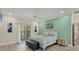 Bedroom featuring wood floors, a king bed, accent wall, and a private balcony at 7538 Camden Harbour Dr, Bradenton, FL 34212