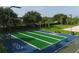 Shuffleboard area with green landscaping, benches, shade, and hopscotch at 7538 Camden Harbour Dr, Bradenton, FL 34212