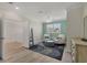 Sitting room featuring wood floors, an accent wall, and plenty of natural light at 7538 Camden Harbour Dr, Bradenton, FL 34212