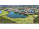 Scenic aerial view of condo complex and golf course, near lake at 7803 Grand Estuary Trl # 102, Bradenton, FL 34212