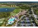 Panoramic aerial view of the golf course, lake, pool area, and luxurious homes at 7803 Grand Estuary Trl # 102, Bradenton, FL 34212