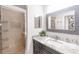 Updated bathroom featuring glass shower and granite countertops at 7803 Grand Estuary Trl # 102, Bradenton, FL 34212