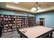 Well-appointed billiard room with a pool table, bookshelves, and a cozy atmosphere at 7803 Grand Estuary Trl # 102, Bradenton, FL 34212
