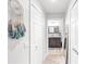 Hallway leading to the bathroom with closet and decor at 7803 Grand Estuary Trl # 102, Bradenton, FL 34212