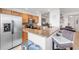 Kitchen with stainless steel appliances, granite countertops, breakfast bar and casual seating at 7803 Grand Estuary Trl # 102, Bradenton, FL 34212
