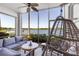Relaxing lanai with comfortable seating and beautiful lake views at 7803 Grand Estuary Trl # 102, Bradenton, FL 34212