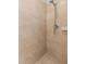 Shower stall featuring beige tiled walls and floor plus a modern shower head at 7803 Grand Estuary Trl # 102, Bradenton, FL 34212