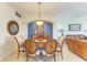 Formal dining room featuring a wood table and ornate chandelier at 8304 Grand Estuary Trl # 104, Bradenton, FL 34212