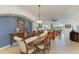 Open dining area with decorative furniture, leading to a living room with outside views at 8304 Grand Estuary Trl # 104, Bradenton, FL 34212