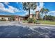Exterior view of clubhouse entrance, showcasing attractive landscaping at 8304 Grand Estuary Trl # 104, Bradenton, FL 34212