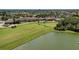 Aerial view showcases the serene golf course and waterfront living that this community offers its residents at 8304 Grand Estuary Trl # 104, Bradenton, FL 34212