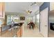 Charming breakfast nook with a view, adjacent to the kitchen and a large window at 8304 Grand Estuary Trl # 104, Bradenton, FL 34212
