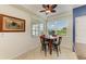 Bright kitchen nook with a window view, casual seating, and decorative ceiling fan at 8304 Grand Estuary Trl # 104, Bradenton, FL 34212