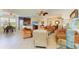 Inviting living room area connects to the kitchen and dining areas in an open concept design at 8304 Grand Estuary Trl # 104, Bradenton, FL 34212